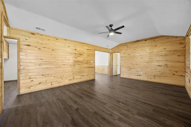 a view of room with wooden floor