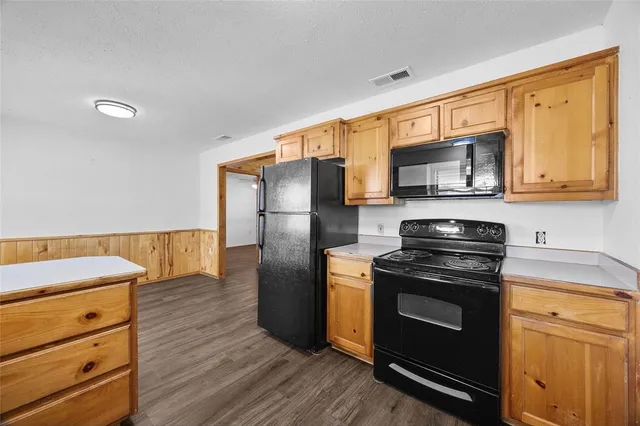 a kitchen with a stove microwave and refrigerator