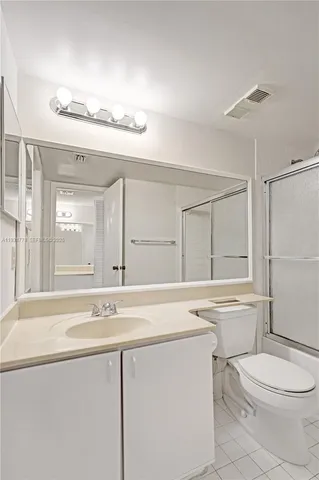 a bathroom with a sink a toilet and a bathtub