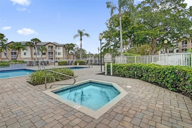 a view of a swimming pool with a lounge chairs