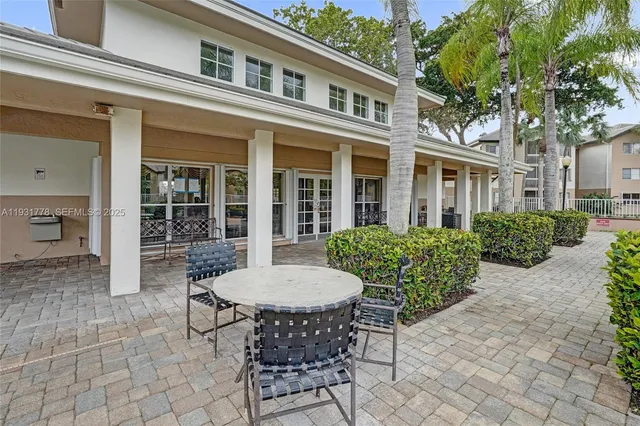 a view of a swimming pool with an outdoor space and seating area