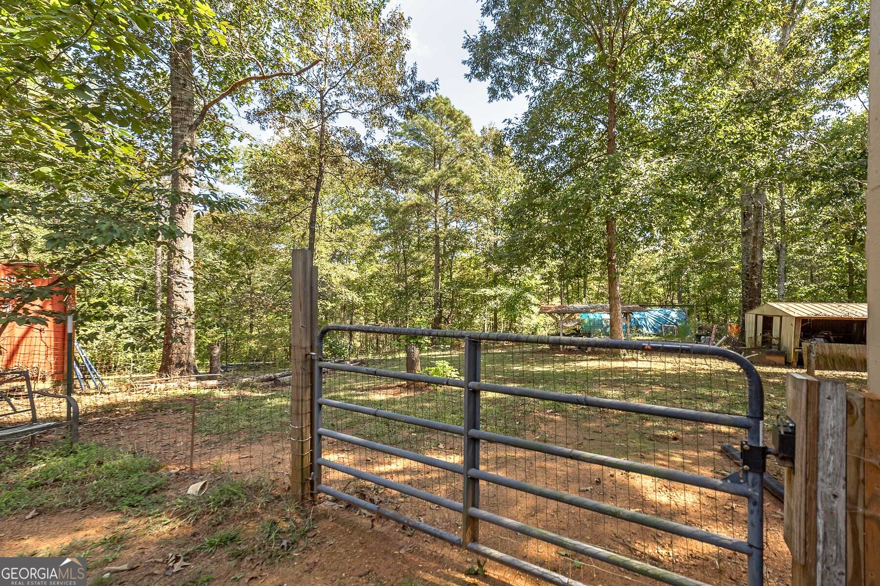 447 Grandview Road Mansfield, GA 30055 - Photo 40 of 65 a view of a tennis court with trees in the background