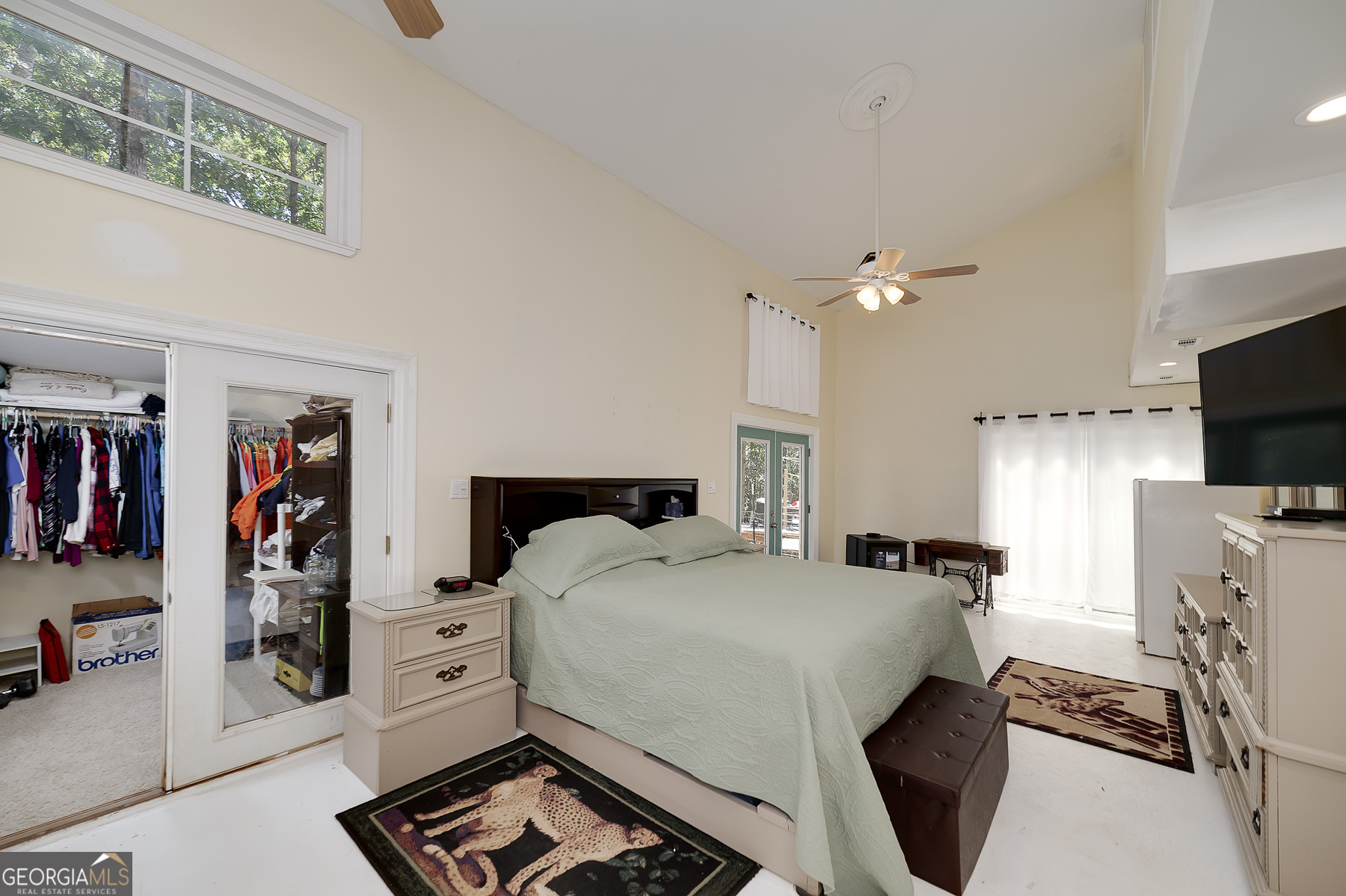 447 Grandview Road Mansfield, GA 30055 - Photo 46 of 65 a bedroom with a bed and a tv on the dresser