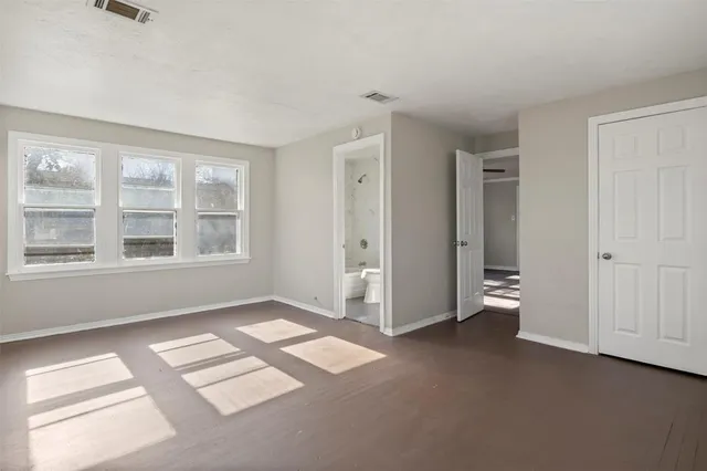 an empty room with windows