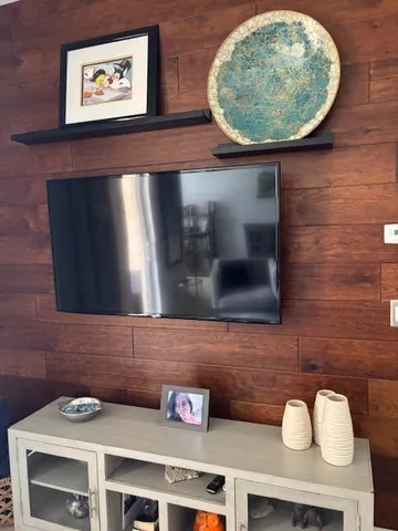 an empty room with furniture and a fireplace