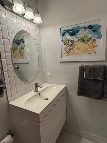 a bathroom with a toilet and a sink