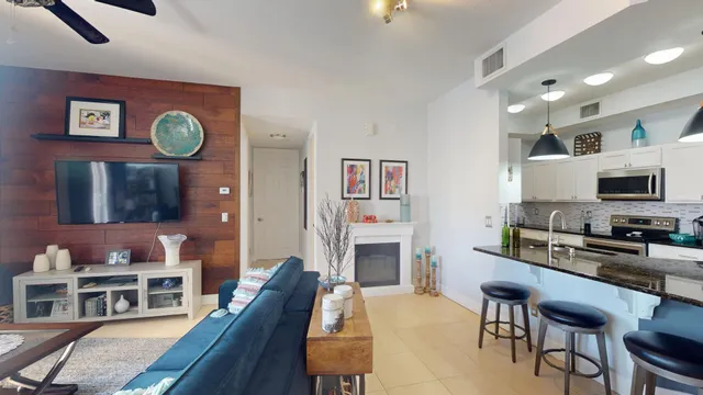 a bedroom with a bed and painting on the wall