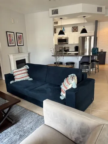 a living room with furniture and a window