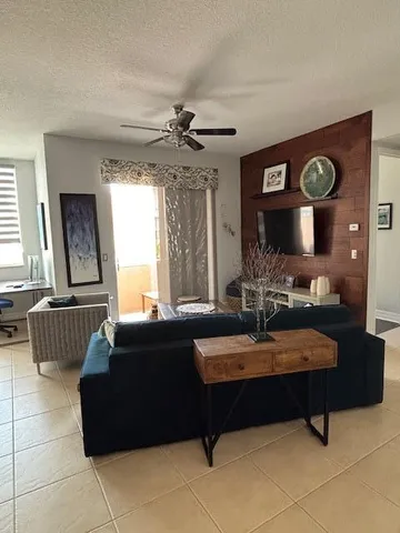 a view of an chairs and table in a room