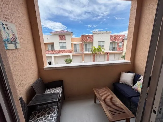 a outdoor living space with furniture and a window