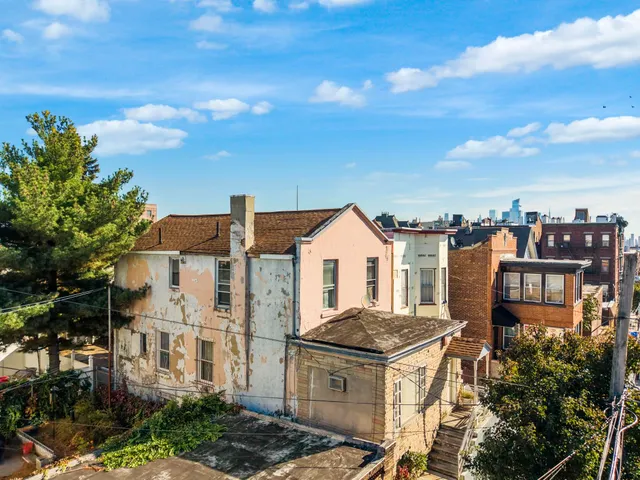 a view of city with tall buildings