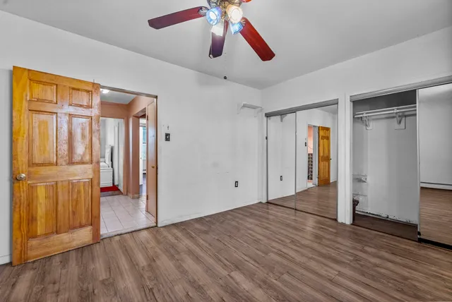 a view of entryway with wooden floor