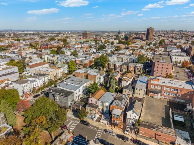 an aerial view of a city with lots of residential buildings