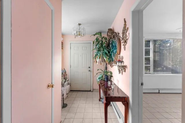 a view of a hallway and dining room