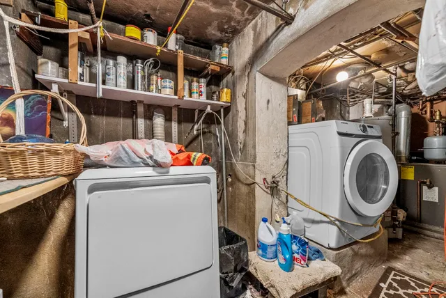 a room with gym equipment and a view of living room