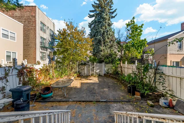 a view of a potted flower in the corridor