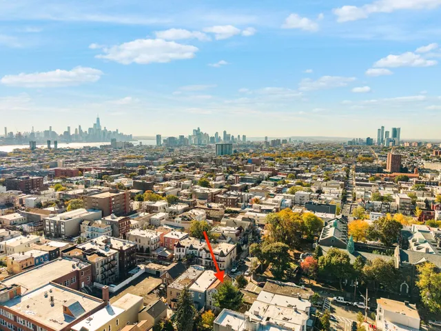 an aerial view of a houses with outdoor space