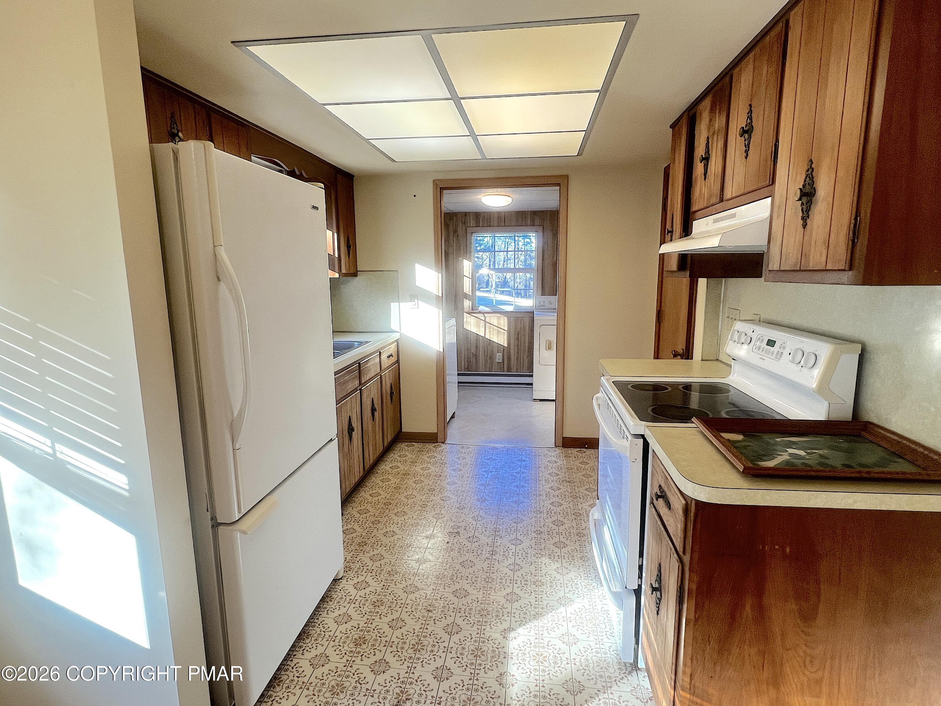 617 School Road Nazareth, PA 18064 - Photo 15 of 30 a kitchen with stainless steel appliances granite countertop a refrigerator a stove and a sink