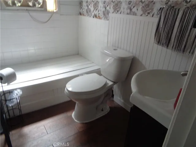 a bathroom with a toilet and a sink