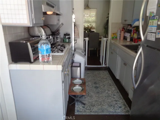 a kitchen with refrigerator and washer