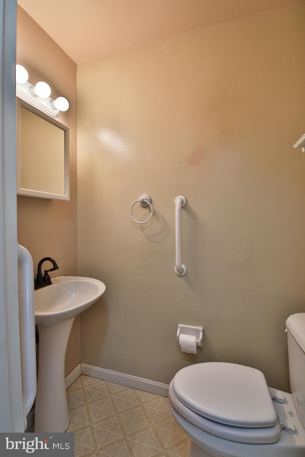 531 Locust Avenue Westminster, MD 21157 - Photo 13 of 31 a white toilet sitting next to a bathroom sink