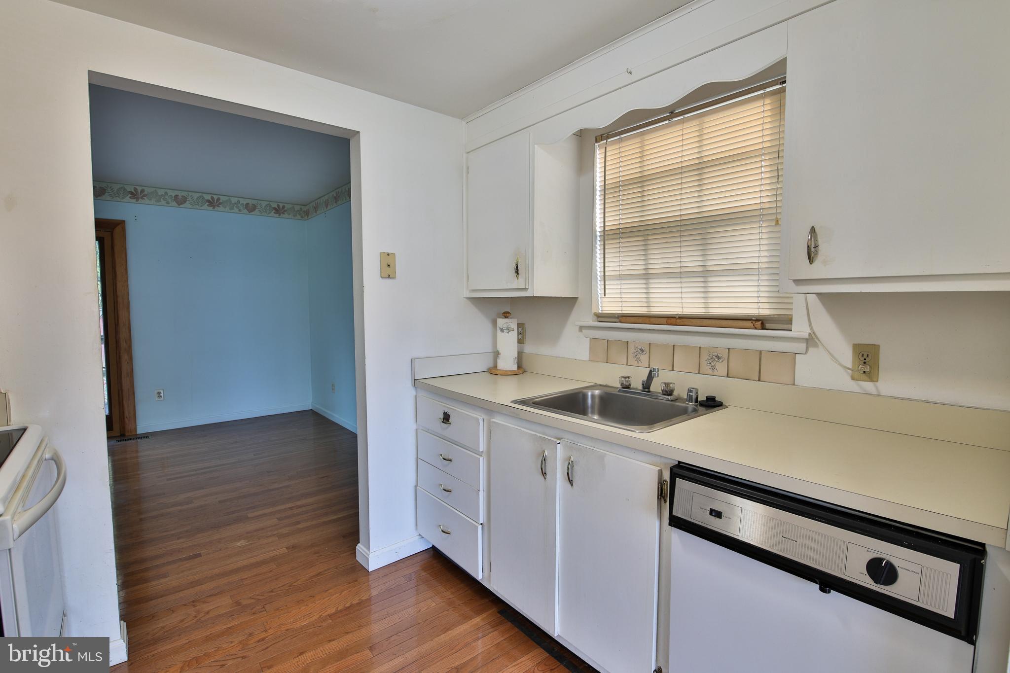 531 Locust Avenue Westminster, MD 21157 - Photo 4 of 31 a kitchen with a sink stove and cabinets