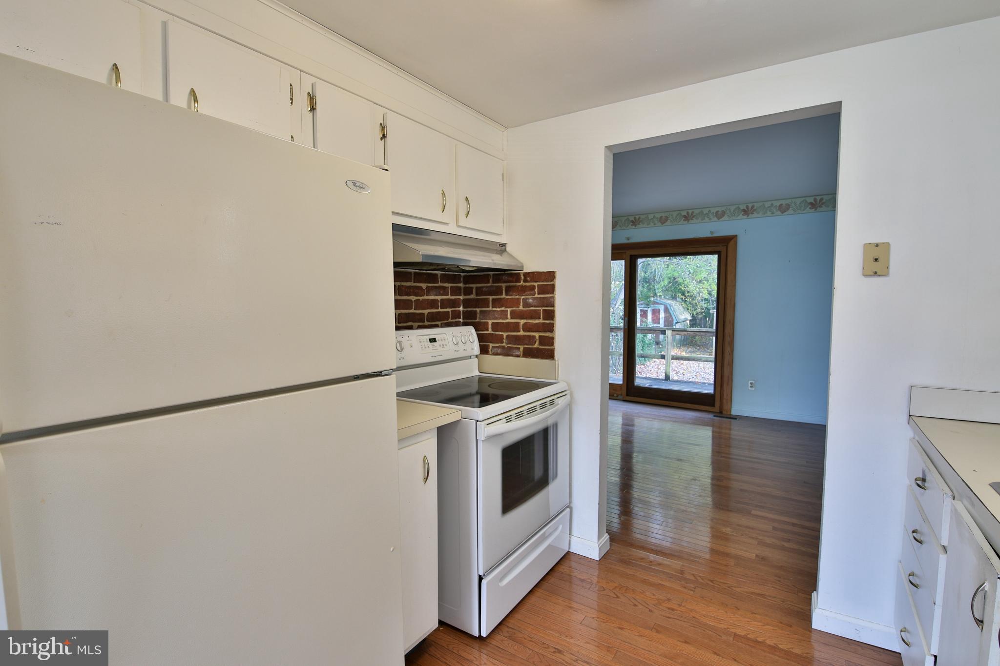 531 Locust Avenue Westminster, MD 21157 - Photo 5 of 31 a kitchen with stainless steel appliances a stove a microwave and a refrigerator