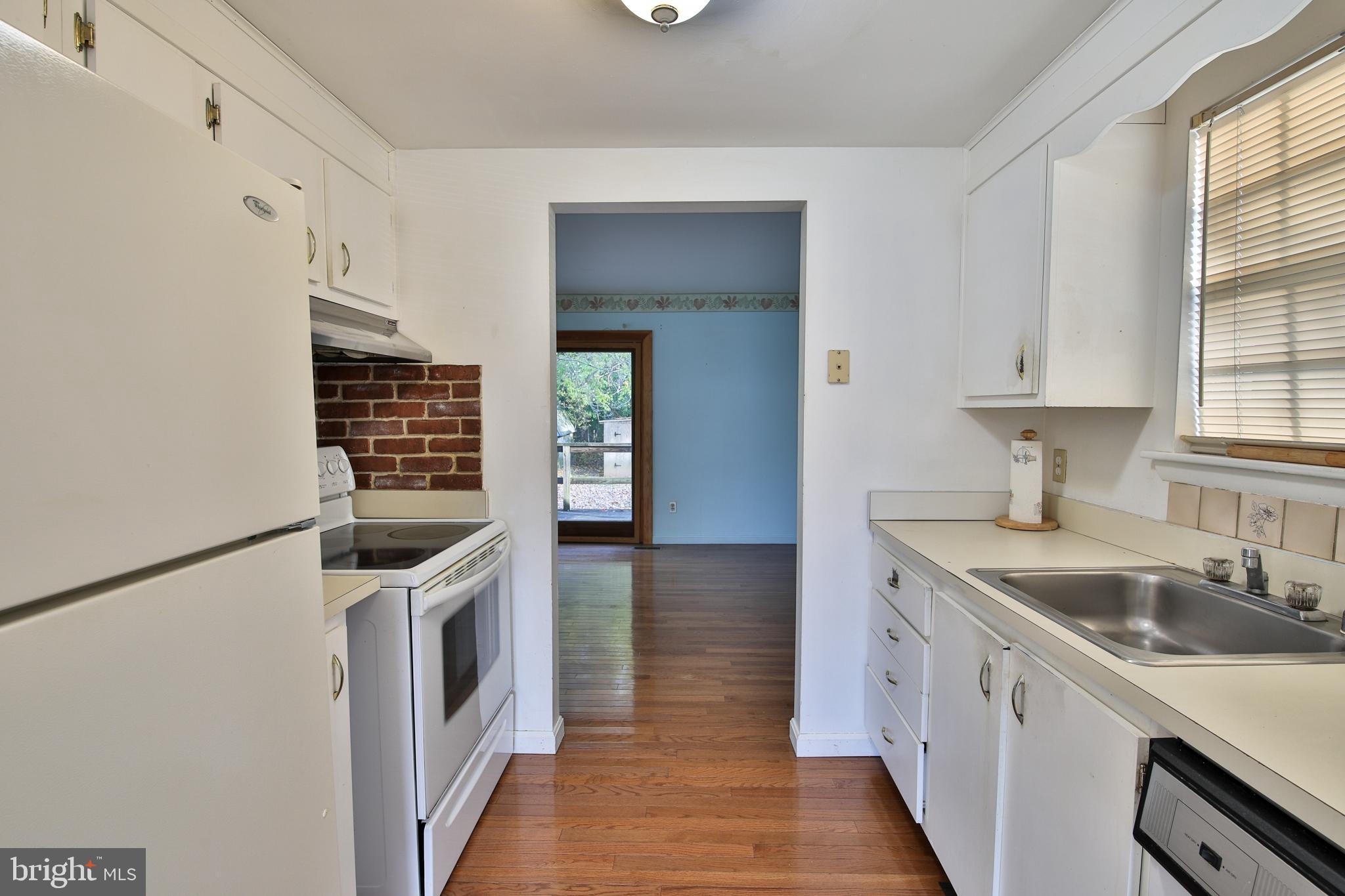 531 Locust Avenue Westminster, MD 21157 - Photo 6 of 31 a kitchen with a sink and a stove top oven