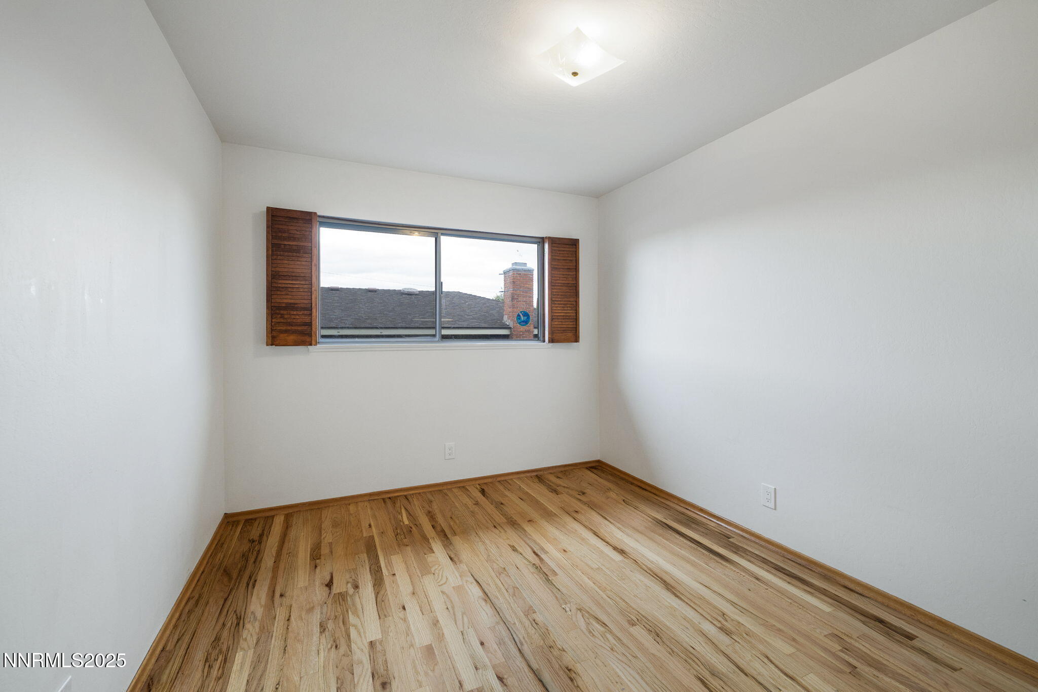 1835 Marlette Avenue Reno, NV 89503 - Photo 23 of 36 a view of empty room with wooden floor and fan