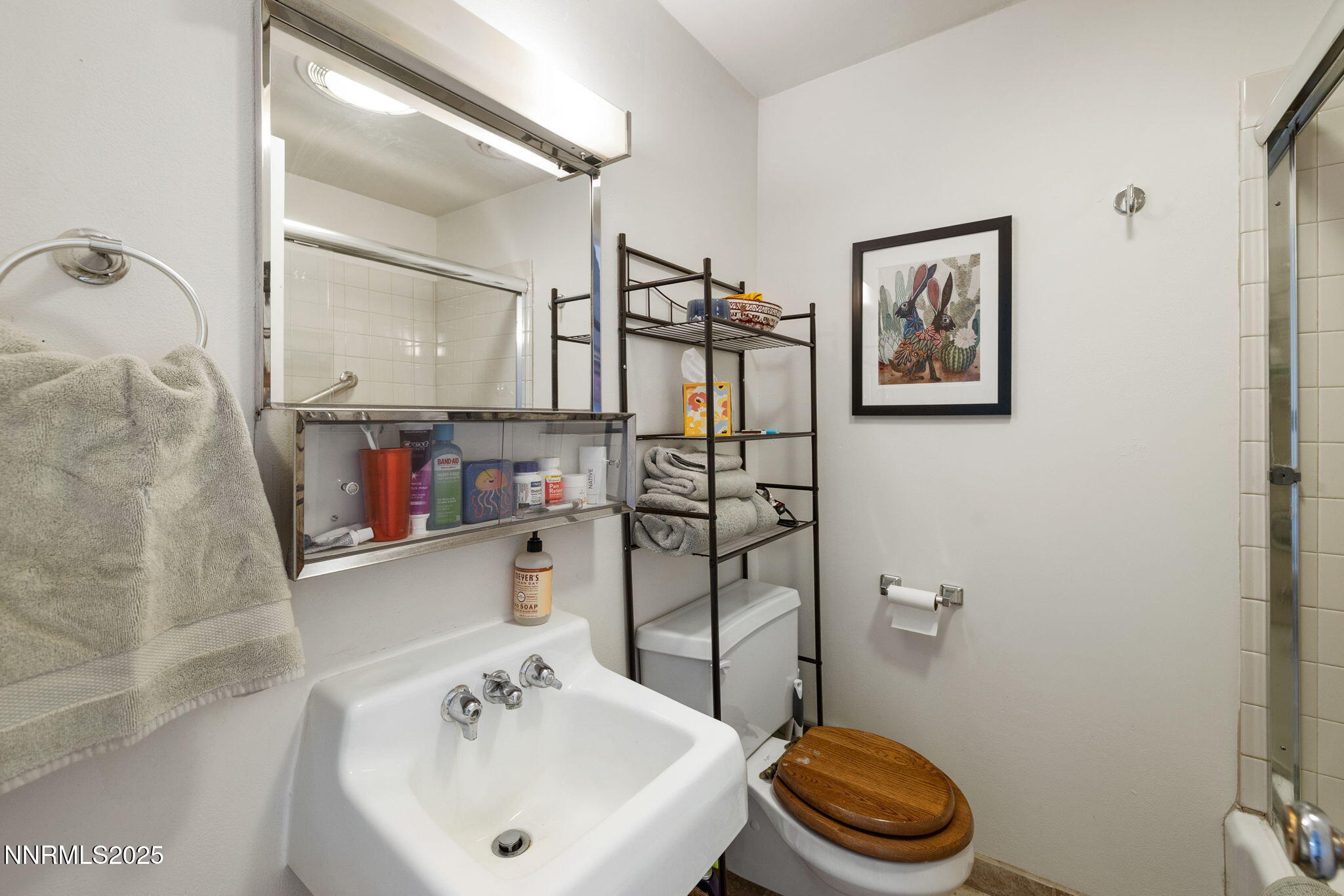 1835 Marlette Avenue Reno, NV 89503 - Photo 30 of 36 a bathroom with a sink a toilet and a mirror