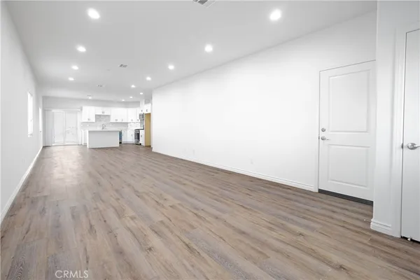 a view of a kitchen with wooden floor
