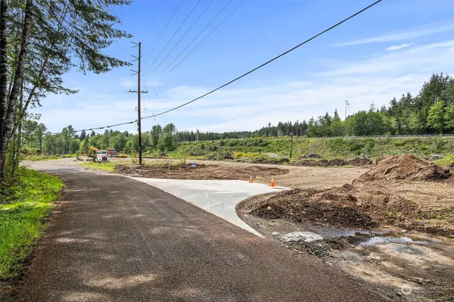 a view of a road with a yard