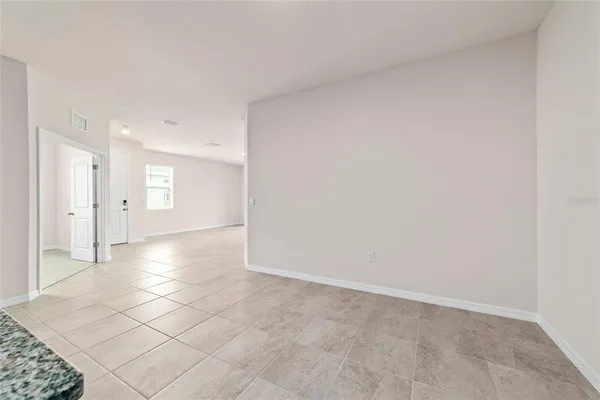 a view of a hallway with a bathroom
