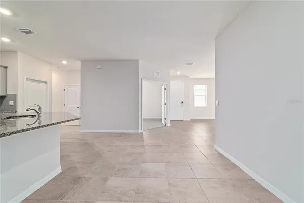 a view of a hallway with a bathroom