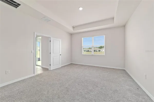 an empty room with windows and windows