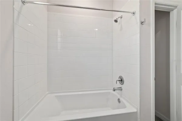 a close up of a bathtub curtain