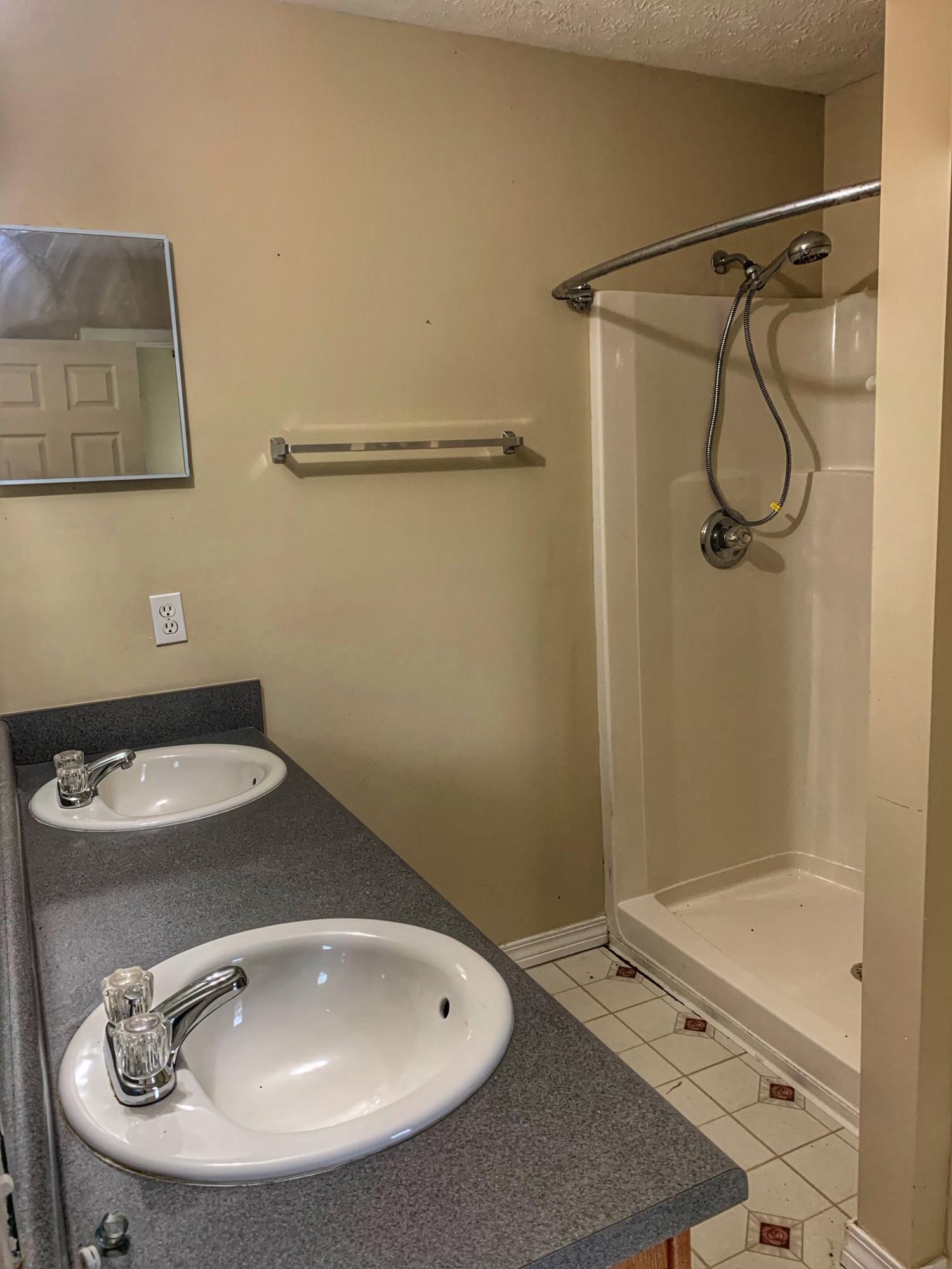 657 Elmwood Road DeFuniak Springs, FL 32433 - Photo 14 of 15 a bathroom with a sink and a mirror