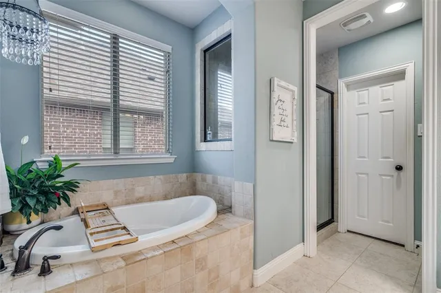 a bathroom with a sink a light fixture and a mirror