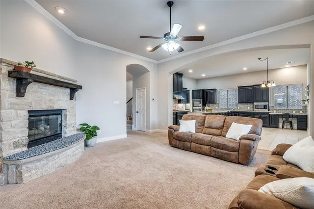 a view of a livingroom with furniture and a fireplace