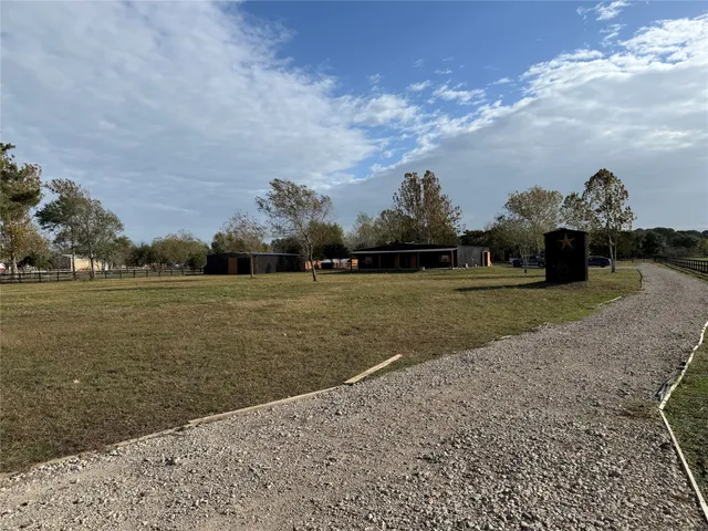 a view of a lake with a yard