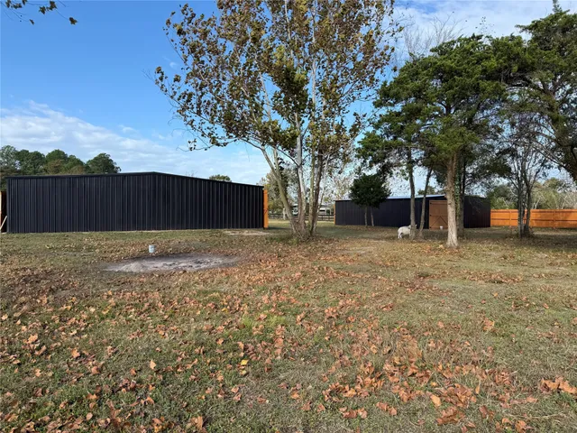 a view of outdoor space with deck and tree