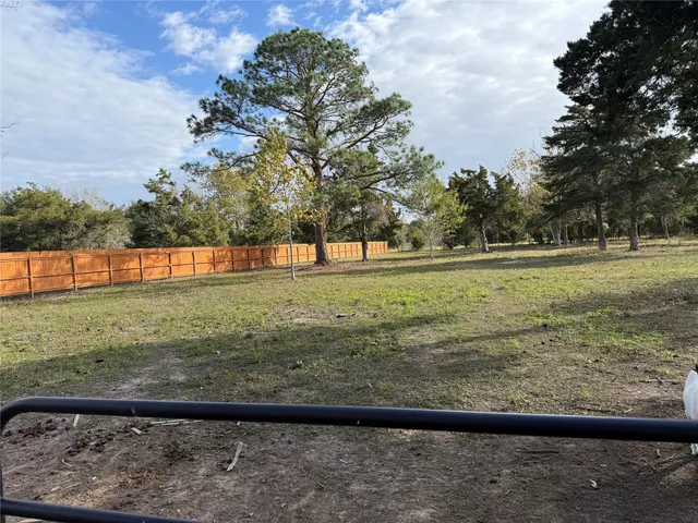 a view of a yard with an outdoor space