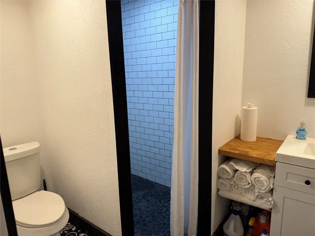 a bathroom with a toilet and a sink