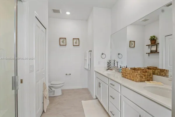 a bedroom with a bed and a table
