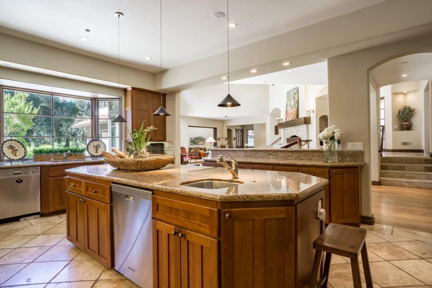3 Garzas Trail Carmel, CA 93923 - Photo 8 of 26 a kitchen with a sink a counter and chairs