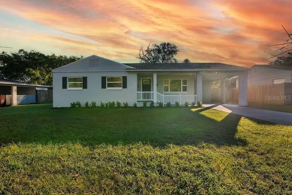 a view of a house with a yard