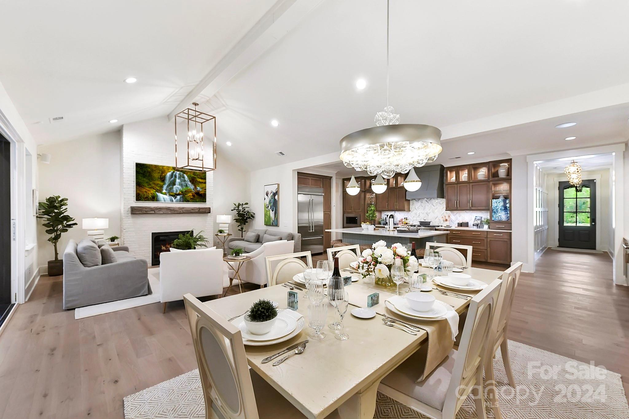 335 Bubbling Well Road Matthews, NC 28105 - Photo 11 of 48 a view of a dining room and livingroom with furniture a rug a potted plant and a chandelier