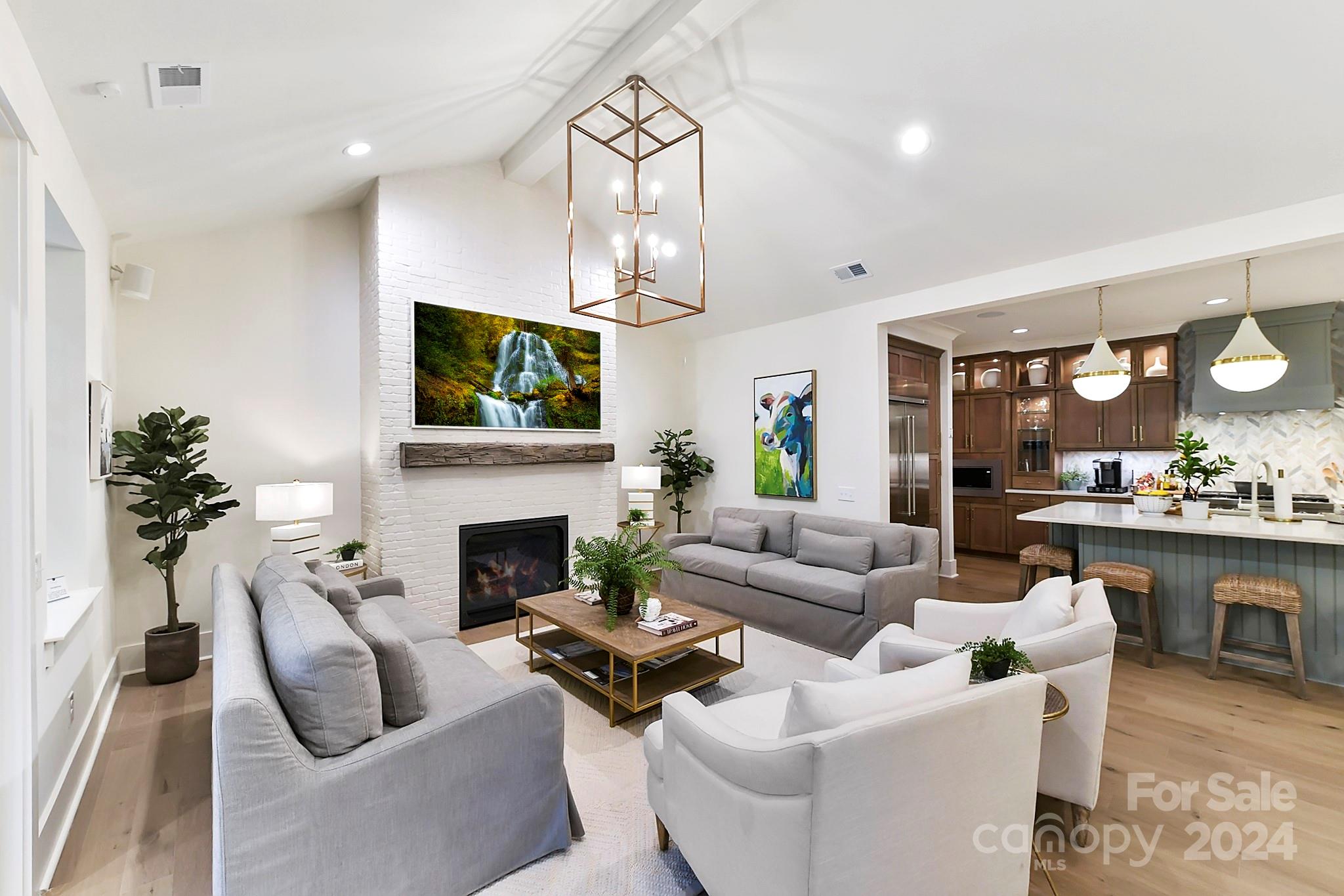 335 Bubbling Well Road Matthews, NC 28105 - Photo 14 of 48 a living room with furniture a fireplace and a flat screen tv