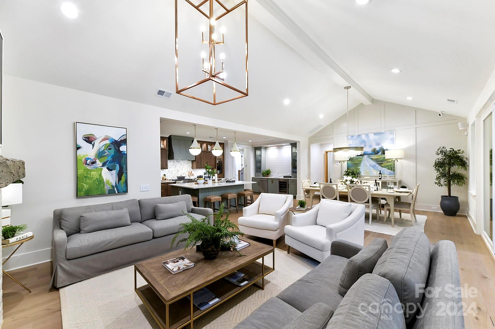335 Bubbling Well Road Matthews, NC 28105 - Photo 15 of 48 a living room with furniture potted plant and kitchen view