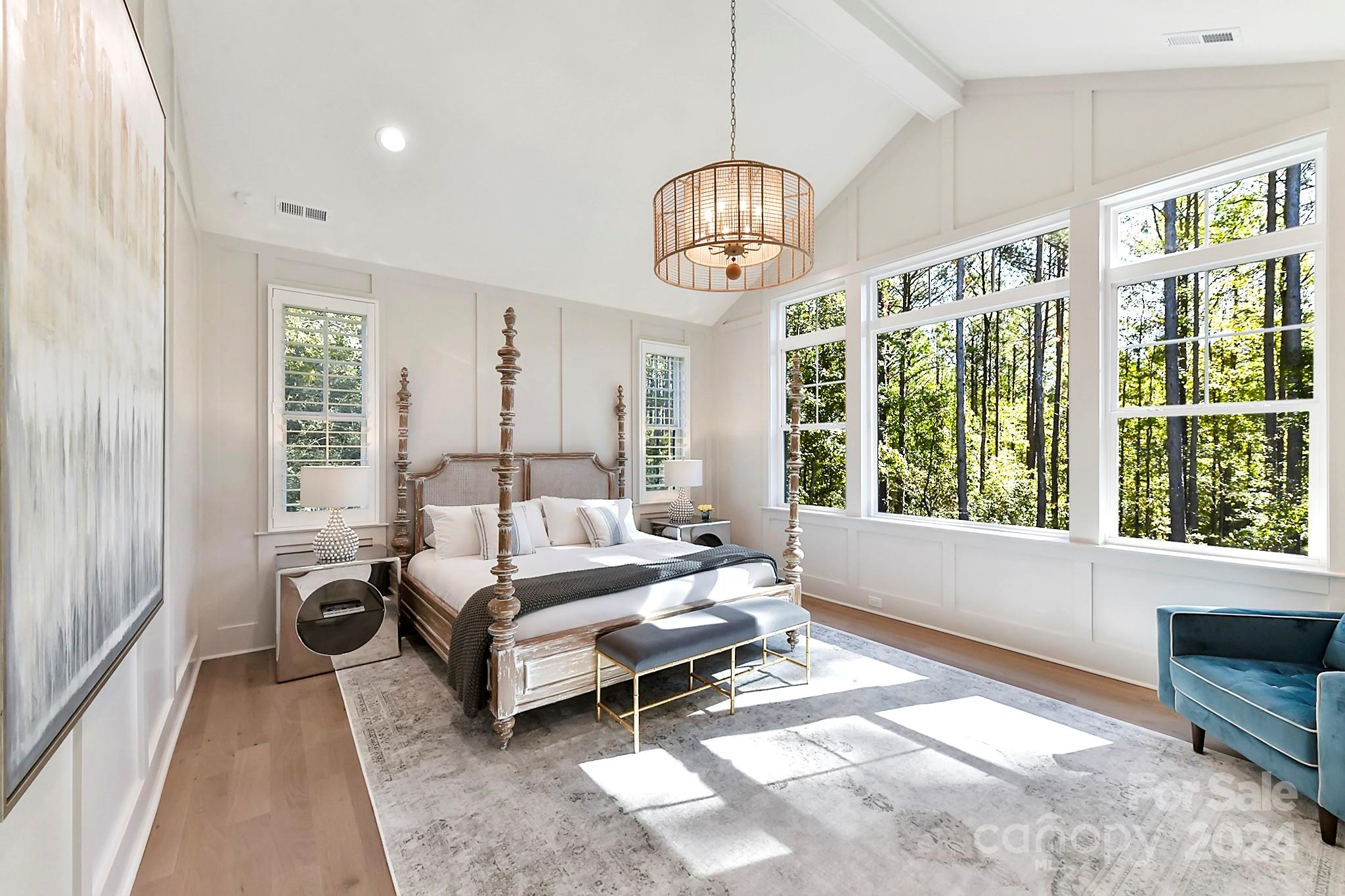 335 Bubbling Well Road Matthews, NC 28105 - Photo 16 of 48 a living room with furniture chandelier and a large window
